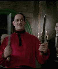 Gif anitmation of Gomez Adams playing with sharp knives.