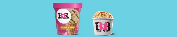 A Baskin-Robbins Pralines 'n Cream ice cream pint with a bright pink lid on the left, next to a white Baskin-Robbins cup filled with three scoops of the same light brown ice cream on the right. Both show the BR logo in pink and blue. The background is solid light blue.
