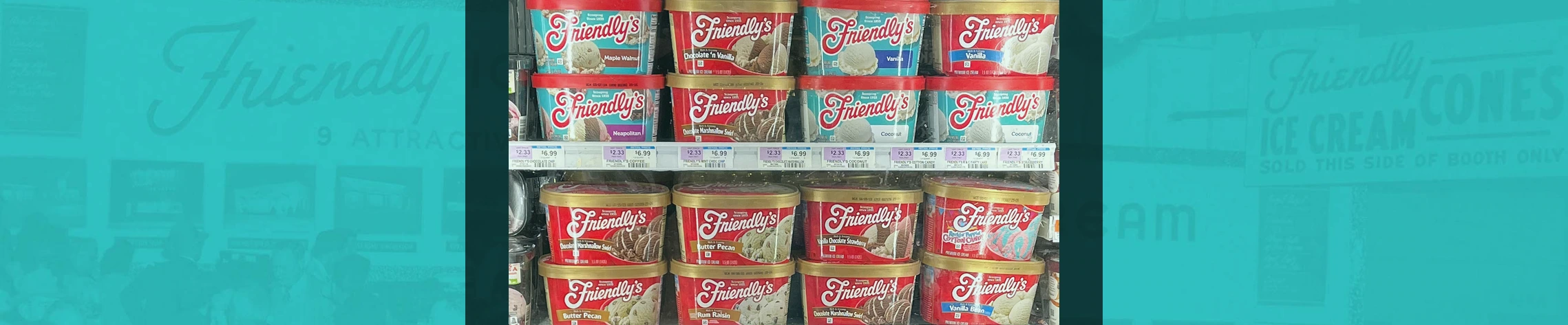Friendly's ice cream cartons displayed in a supermarket freezer case with multiple flavors visible in the frozen aisle.
