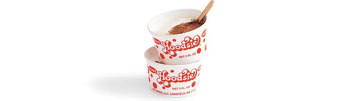 Two stacked Hood Hoodsie Cups white single-serve ice cream cups with red Hoodsie logo and polka dots, chocolate and vanilla swirl, wooden spoon, 3 fluid ounces.
